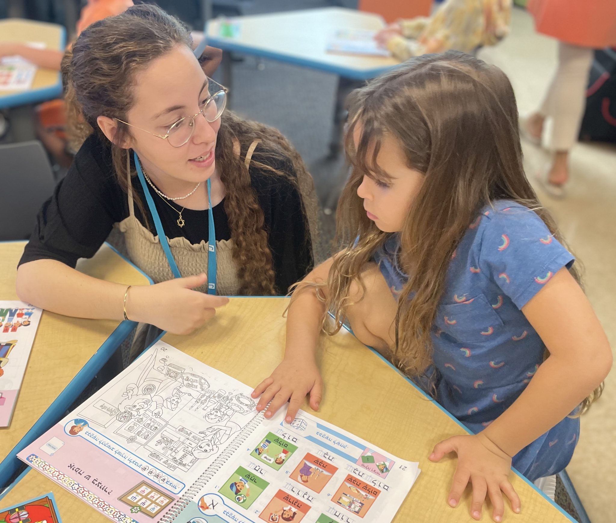 Talia works with a kindergarten student on her Hebrew vocabulary.
